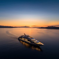 Luxury yacht at sunset.