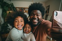 Happy African American family taking selfie. 