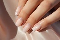 Woman hand's with beige nails. 