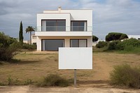 Modern villa with a blank sign. 