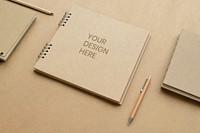 Natural brown paper notebook with pencils mockup