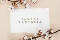 Cotton flower branch with a white card mockup on a beige background