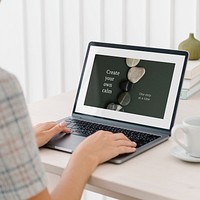 Laptop screen mockup psd with zen stones as wallpaper