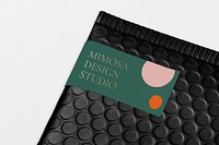 Shipping label mockup, black bubble mailer bag psd