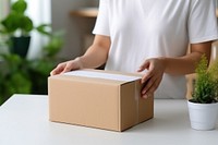 Cardboard box carton adult. AI generated Image by rawpixel.