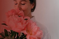 Woman smelling flower background, pink design