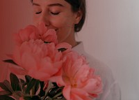 Woman smelling flower background, pink design