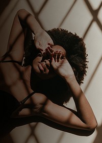 Woman background, laying on the ground, window shadow image