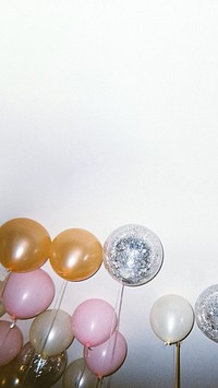 Floating balloons border iPhone wallpaper, party image