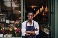 Cheerful standing smiling waiter. 