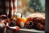 Candle windowsill pumpkin autumn. 