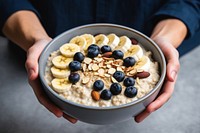 Bowl holding food meal. 