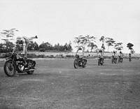 British women dispatch riders. South African girls who went to England to join the "First Aid and Nursing Yeomanry" learn stunt riding to give them balance and confidence in handling their machines. They are members of a dispatch riding section. Sourced from the Library of Congress.