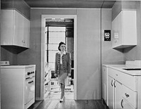 Modern kitchen in a Tennessee Valley Authority house. Kitchen equipment for one of the new demountable houses, which the TVA is building for defense workers in the Muscle Shoals area in northern Alabama, includes electric range, water heater, and refrigerator. The TVA, acting as an agent of the Federal Works Administrator, is building. Sourced from the Library of Congress.