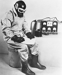 Testing one of 12,000 General Electric electrically heated flying suits being made for the U.S. Air Corps, at sixty-three degrees below zero (Fahrenheit) in cold room at Fort Monmouth, New Jersey. D. C. Spooner, Jr., head of General Electric pioneer products division, Bridgeport, in suit. Sourced from the Library of Congress.