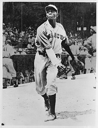 [Untitled photo shows: Satchel Paige, in the Kansas City Monarchs uniform at a baseball game]. Sourced from the Library of Congress.