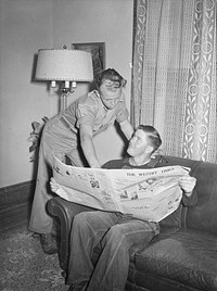 [Untitled photo, possibly related to: Vernon County, Wisconsin. Robert and a hired man discussing news in the parlor after dinner]. Sourced from the Library of Congress.