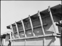 Rammed earth construction near Birmingham, Alabama. Concrete slate roofs may be used in place of wood decks. Sourced from the Library of Congress.