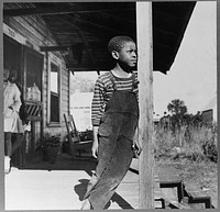 Daytona Beach, Florida. Young boy on his front porch. Sourced from the Library of Congress.