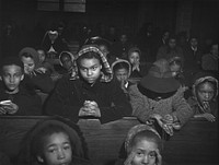 Mass at a  Catholic church on the South Side, Chicago, Illinois. Sourced from the Library of Congress.