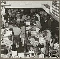 San Francisco, Calif. Apr. 1942. Customers buying merchandise in a store operated by a proprietor of Japanese ancestry, during a pre-evacuation sale. The operator, of Japanese descent, will be evacuated and will be housed in War Relocation Authority centers for the duration of the war. Sourced from the Library of Congress.