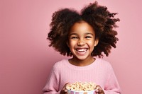 Laughing popcorn eating smile. 