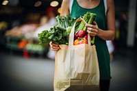 Vegetable bag holding market. AI generated Image by rawpixel.