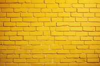 Yellow backgrounds brick wall. 