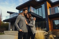 Couple with their new house. 