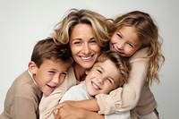 Child laughing hugging family. 