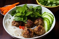 Meatball plate herbs food. 