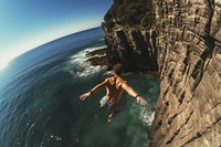 Cliff swimming outdoors jumping. 