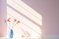 Windowsill sunlight lighting flower. 