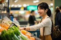 Supermarket groceries smiling adult. 