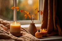 Candle window autumn illuminated. 
