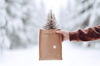 Christmas outdoors holding person. AI generated Image by rawpixel.
