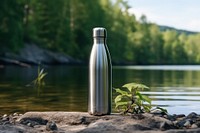Bottle outdoors nature water. AI generated Image by rawpixel.