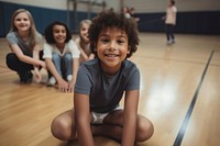 Child smiling sitting gym. 