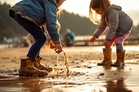 Child outdoors beach adult. 