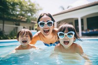 Sunglasses swimming laughing toddler. 