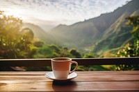 Coffee cup mountain outdoors. 