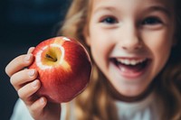 Apple smiling biting fruit. 