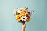 Flower sunflower holding plant. AI generated Image by rawpixel.