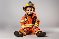 Portrait sitting fireman helmet. 