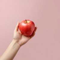 Apple holding fruit plant. 