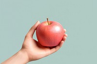 Apple holding fruit plant. AI generated Image by rawpixel.