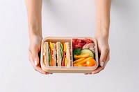 Lunch food box holding. AI generated Image by rawpixel.