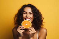 Holding summer orange fruit. 