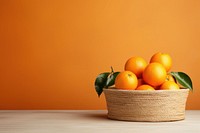 Grapefruit basket orange table. 