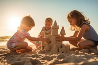 Child sand sea sandcastle. 